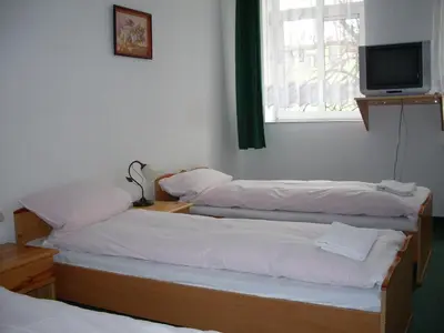 Łóżko lub łóżka w pokoju w obiekcie Hotel Krokus