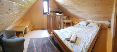 Łóżko lub łóżka w pokoju w obiekcie Dom pod Wilczyńcem