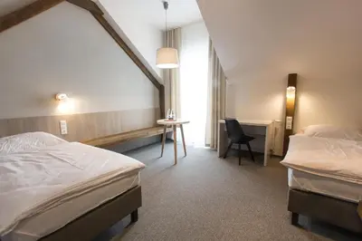 Łóżko lub łóżka w pokoju w obiekcie Hotel Górecznik