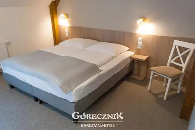 Łóżko lub łóżka w pokoju w obiekcie Hotel Górecznik