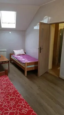 Łóżko lub łóżka w pokoju w obiekcie Pokoje Gościnne 