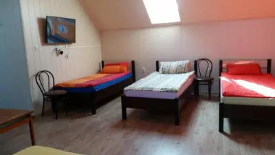 Łóżko lub łóżka w pokoju w obiekcie Pokoje Gościnne 
