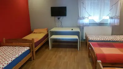 Łóżko lub łóżka w pokoju w obiekcie Pokoje Gościnne 