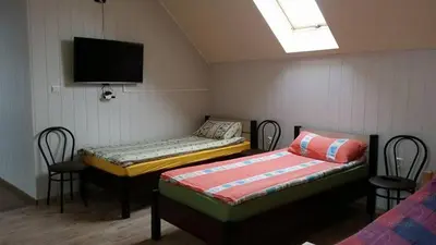 Łóżko lub łóżka w pokoju w obiekcie Pokoje Gościnne 