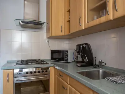 Kuchnia lub aneks kuchenny w obiekcie Nozownicza Street Apartment