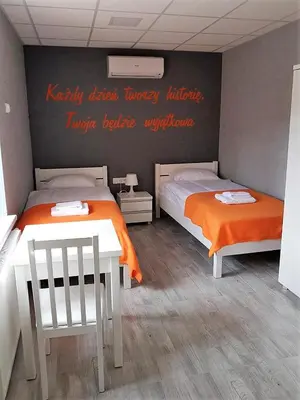 Łóżko lub łóżka w pokoju w obiekcie Dom Sportowca