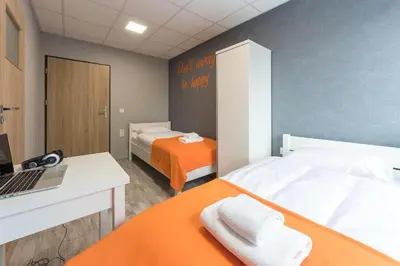 Łóżko lub łóżka w pokoju w obiekcie Dom Sportowca