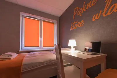 Łóżko lub łóżka w pokoju w obiekcie Dom Sportowca