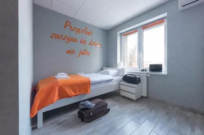 Łóżko lub łóżka w pokoju w obiekcie Dom Sportowca