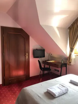 Łóżko lub łóżka w pokoju w obiekcie Chata Walichnowska