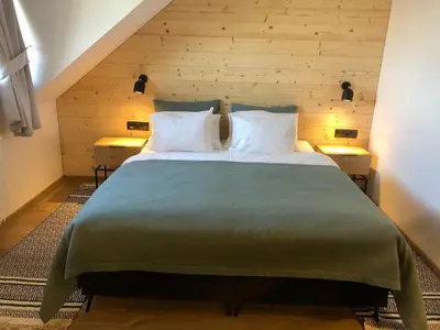 Łóżko lub łóżka w pokoju w obiekcie Chata Walichnowska