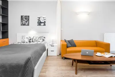 Łóżko lub łóżka w pokoju w obiekcie WrocApartments StarCenter - Parking Free