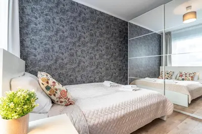 Łóżko lub łóżka w pokoju w obiekcie WrocApartments StarCenter - Parking Free