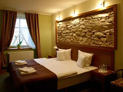 Łóżko lub łóżka w pokoju w obiekcie Hotel Ślęża
