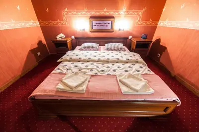 Łóżko lub łóżka w pokoju w obiekcie Apartament Eva