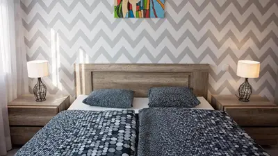 Łóżko lub łóżka w pokoju w obiekcie Apartament Piano 2