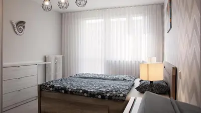 Łóżko lub łóżka w pokoju w obiekcie Apartament Piano 2