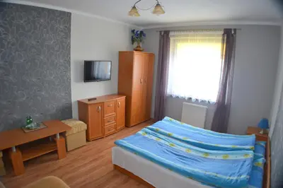 Łóżko lub łóżka w pokoju w obiekcie Ośrodek Pegaz