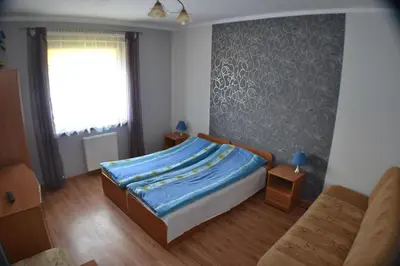 Łóżko lub łóżka w pokoju w obiekcie Ośrodek Pegaz