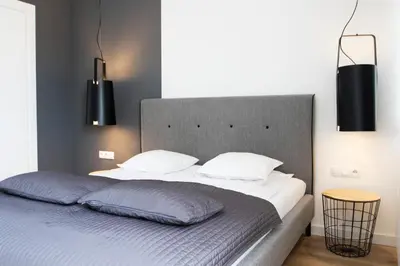Łóżko lub łóżka w pokoju w obiekcie Silver Apartments