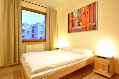 Łóżko lub łóżka w pokoju w obiekcie Apartament Bema 37