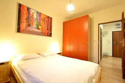 Łóżko lub łóżka w pokoju w obiekcie Apartament Bema 37