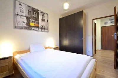 Łóżko lub łóżka w pokoju w obiekcie Apartament Bema 38