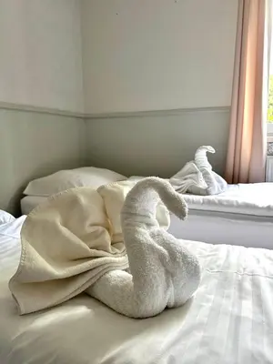 Łóżko lub łóżka w pokoju w obiekcie Centrum Noclegowe Amfiteatr