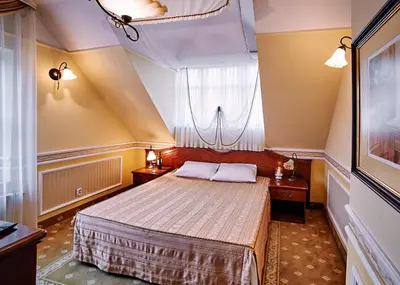 Łóżko lub łóżka w pokoju w obiekcie Villa Royal