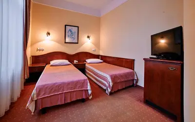 Łóżko lub łóżka w pokoju w obiekcie Villa Royal