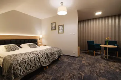 Łóżko lub łóżka w pokoju w obiekcie Hotel Olesno