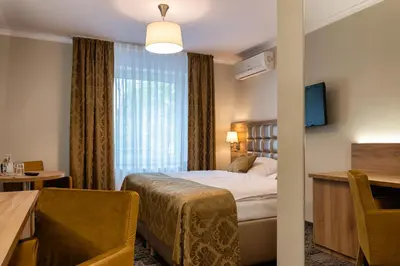 Łóżko lub łóżka w pokoju w obiekcie Hotel Olesno
