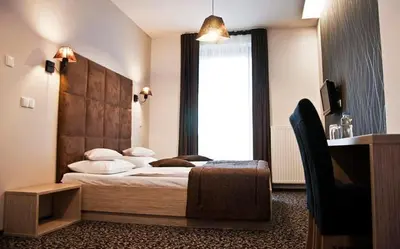 Łóżko lub łóżka w pokoju w obiekcie Hotel Vis A Vis