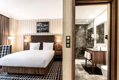 Łóżko lub łóżka w pokoju w obiekcie Hotel Grand City Wrocław