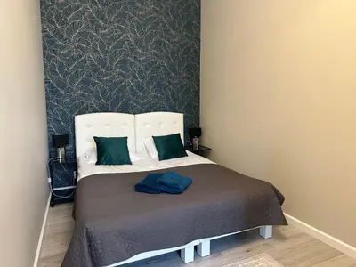 Łóżko lub łóżka w pokoju w obiekcie Apartament Wroclawia