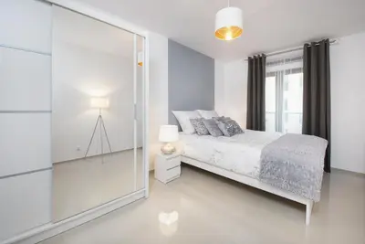 Łóżko lub łóżka w pokoju w obiekcie Icon Apartments Centrum 55m2