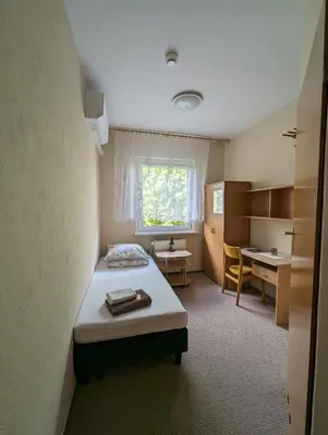 Łóżko lub łóżka w pokoju w obiekcie Motel DRABEK