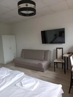 Łóżko lub łóżka w pokoju w obiekcie Zielone Wzgórze