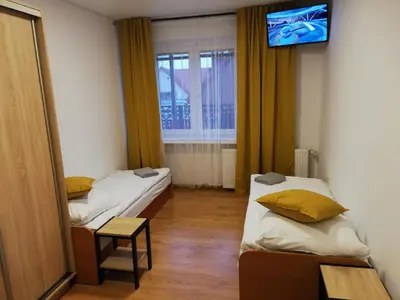 Łóżko lub łóżka w pokoju w obiekcie Apartamenty Nad Odra
