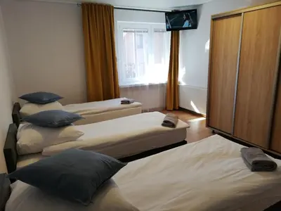 Łóżko lub łóżka w pokoju w obiekcie Apartamenty Nad Odra