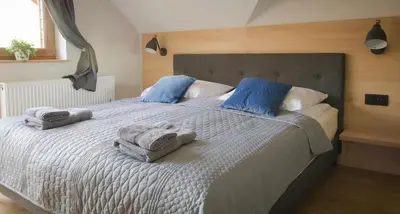 Łóżko lub łóżka w pokoju w obiekcie Agroturystyka Słoszówka