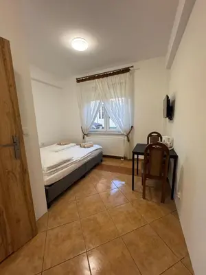Łóżko lub łóżka w pokoju w obiekcie Lawa