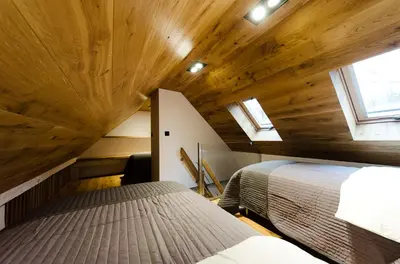 Łóżko lub łóżka w pokoju w obiekcie Apartament Dębowy