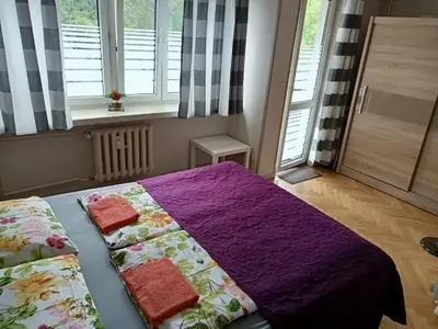 Łóżko lub łóżka w pokoju w obiekcie Kotlarska Apartment
