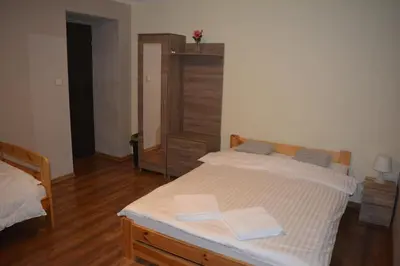 Łóżko lub łóżka w pokoju w obiekcie Sieraton Pokoje i Apartament