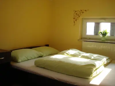 Łóżko lub łóżka w pokoju w obiekcie Green Hostel Wrocław przy ZOO