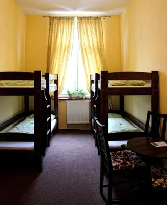 Łóżko lub łóżka w pokoju w obiekcie Green Hostel Wrocław przy ZOO