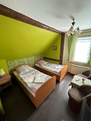 Łóżko lub łóżka w pokoju w obiekcie Ośrodek Wypoczynkowy Lido Noclegi