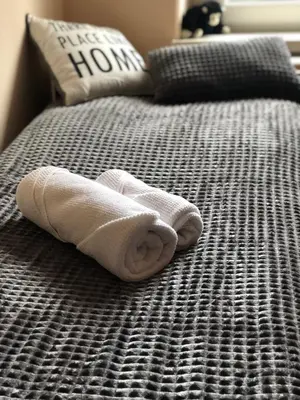 Łóżko lub łóżka w pokoju w obiekcie Apartament 