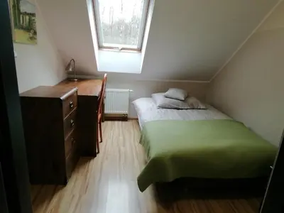 Łóżko lub łóżka w pokoju w obiekcie Zofijówka